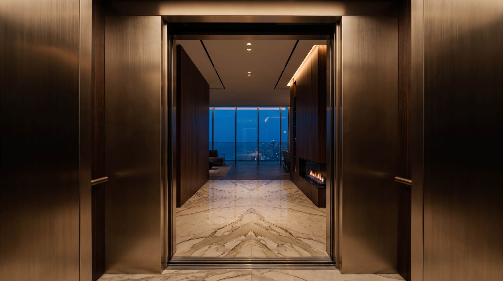 Private elevator opening to the marble entry gallery